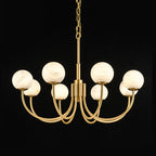 Clérachic studio shot on black with globes unlit, showing the full sweep of the brass arms and chain