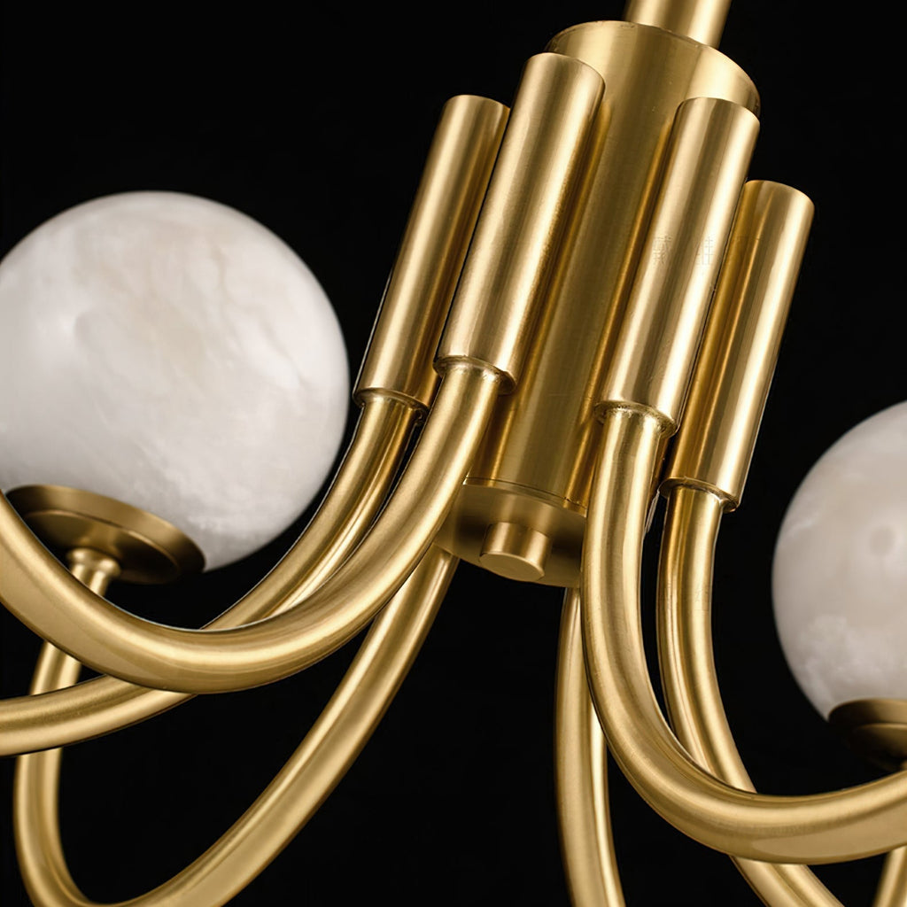 Detail of the Clérachic fluted brass centre column where the curved arms meet the body