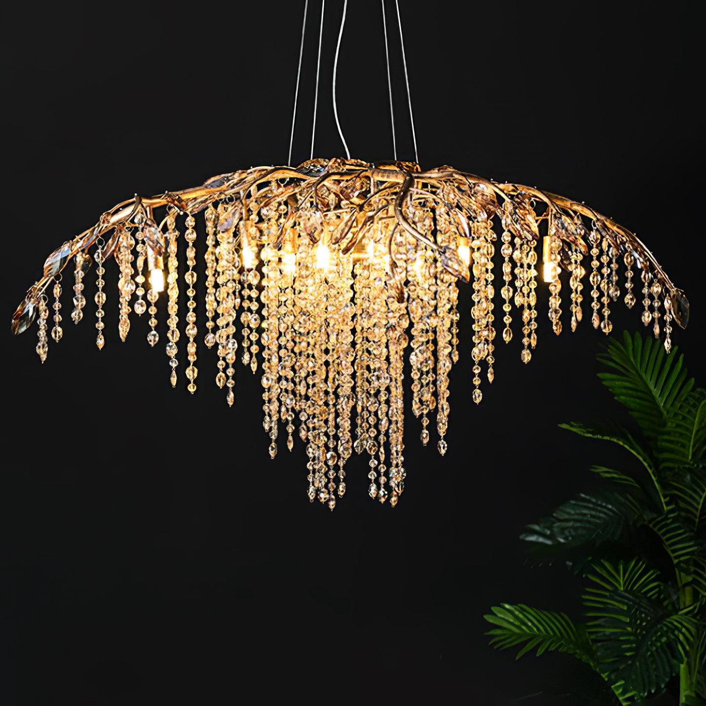 The gold version lit against a black wall, a palm frond entering at the right.