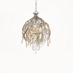 The bell-shaped gold cage on white, viewed straight on with its beads hanging free.