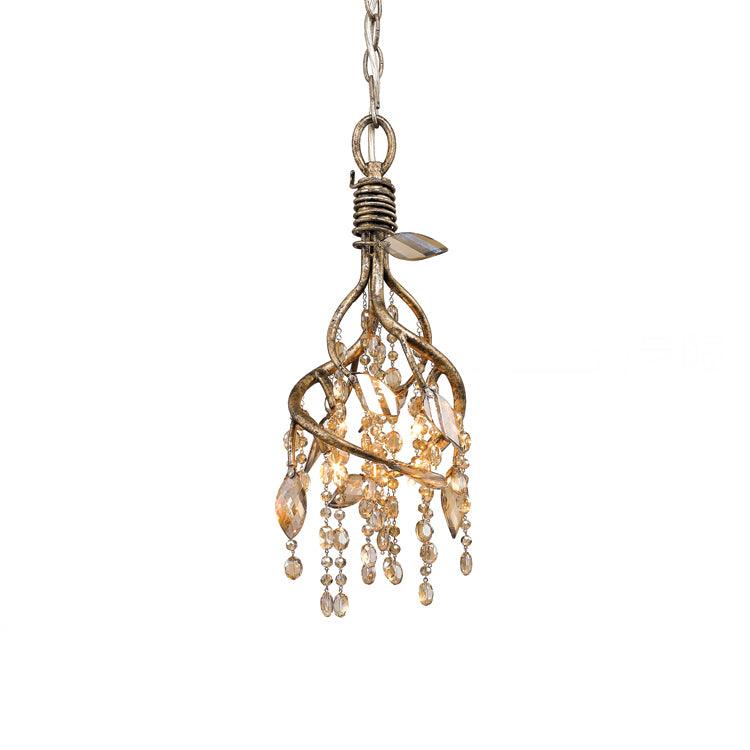 Small branch-cage pendant in gold, amber glass beads hanging inside twisted metal stems, on a chain.