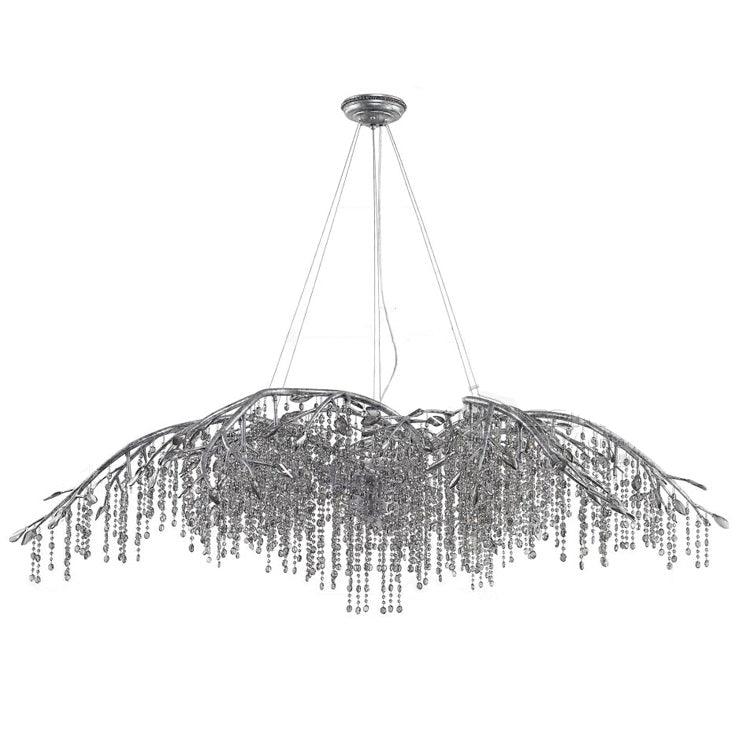 The long silver version, its bare branch tips reaching well past the bead curtain.