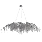 The long silver version, its bare branch tips reaching well past the bead curtain.