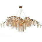A long gold version with extended branches, beads trailing along the full span.