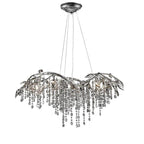 The wide chandelier in silver, grey bead strands hanging beneath outstretched metal branches.