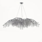 The wide silver chandelier on white, cables rising to a round ceiling plate.