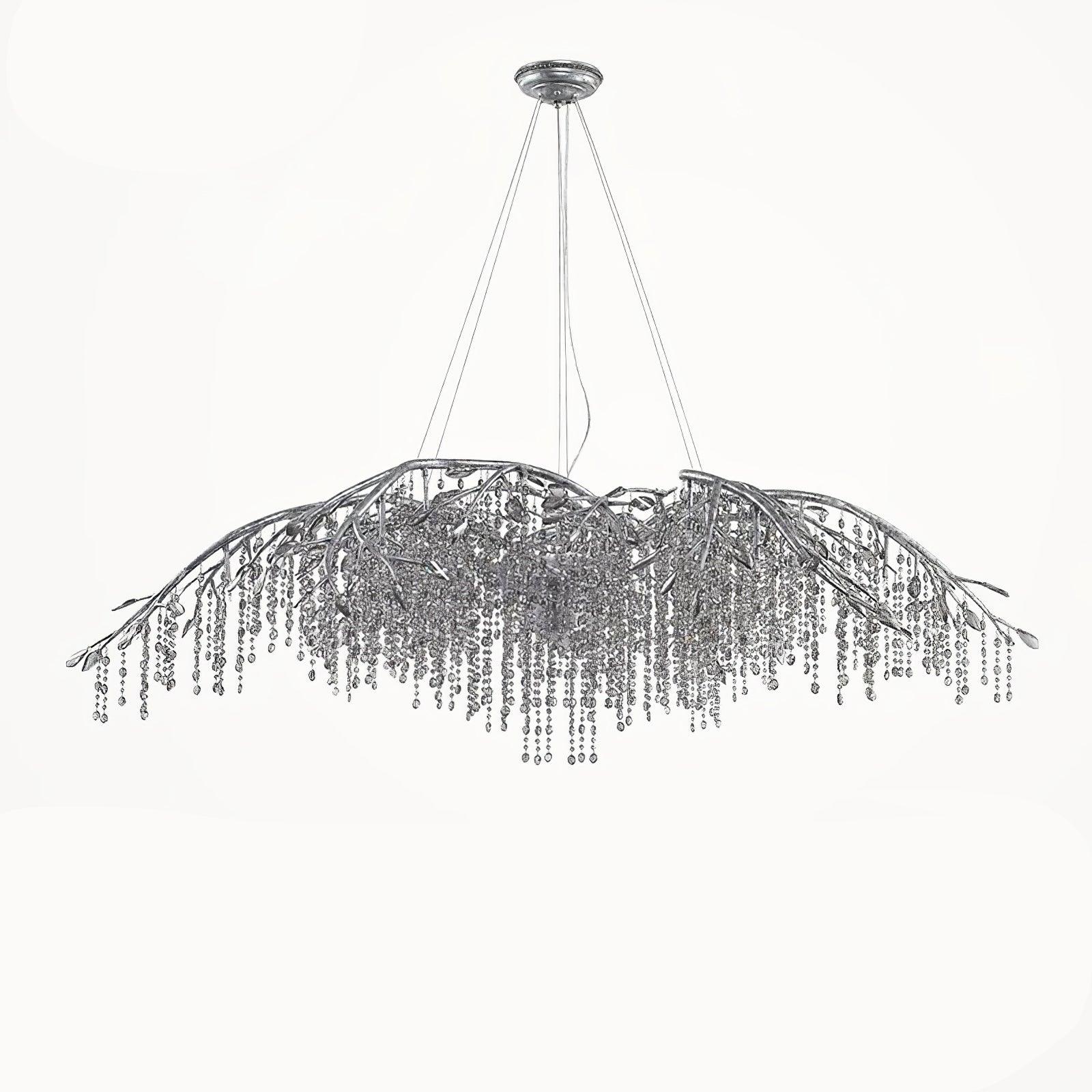 The wide silver chandelier on white, cables rising to a round ceiling plate.