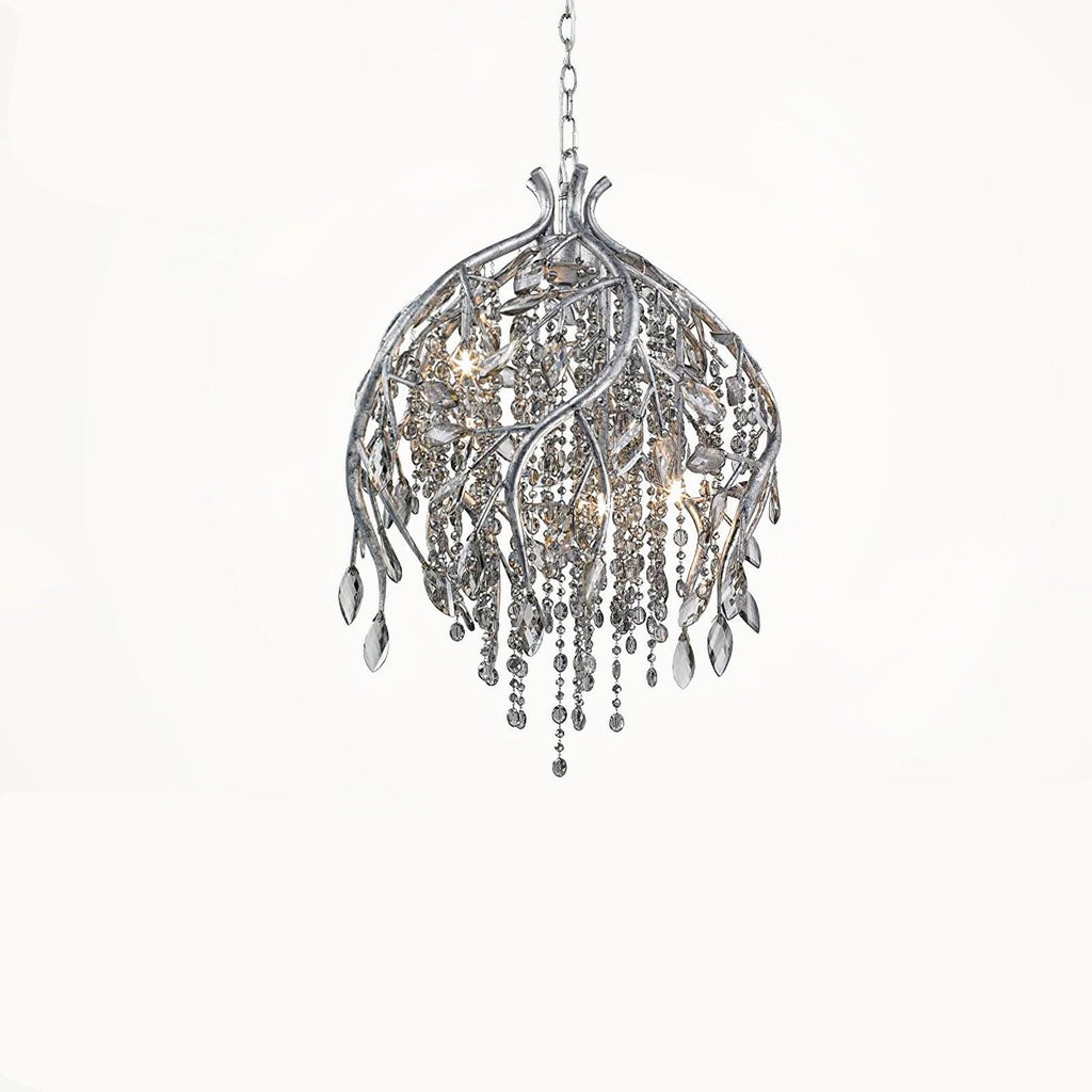 The bell-shaped silver cage on white, clear beads spilling below the twisted stems.