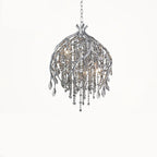 The bell-shaped silver cage on white, clear beads spilling below the twisted stems.