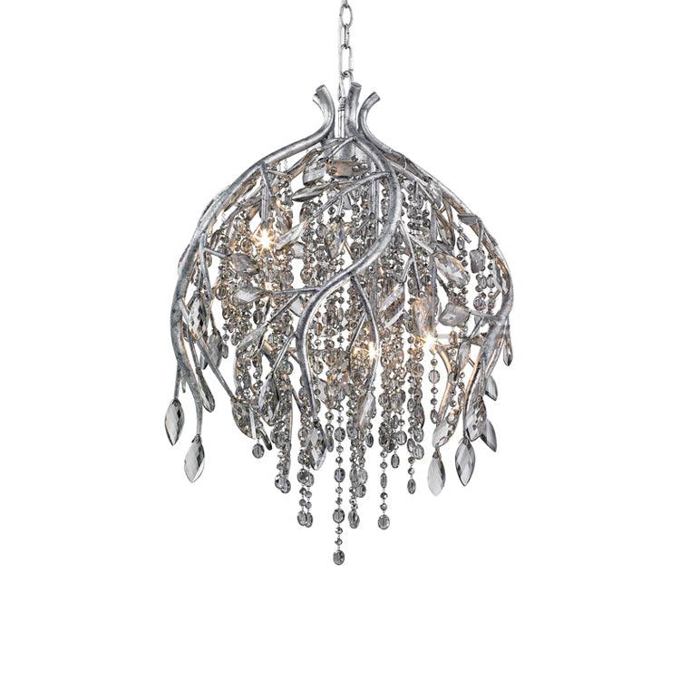 The bell-shaped cage in silver, its stems and clear beads catching light against white.