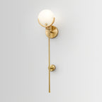 Clérachic full-length view of the tall Zavarara sconce, with the second brass bracket holding the rod mid-wall.