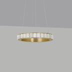 Brass alabaster chandelier against a grey backdrop, unlit, showing the polished inner ring.