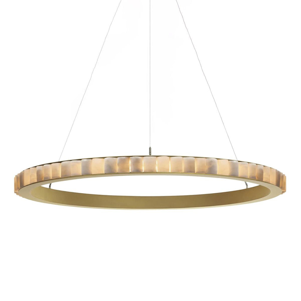 Brass alabaster chandelier lit, warm light washing through alabaster into the brushed gold ring.