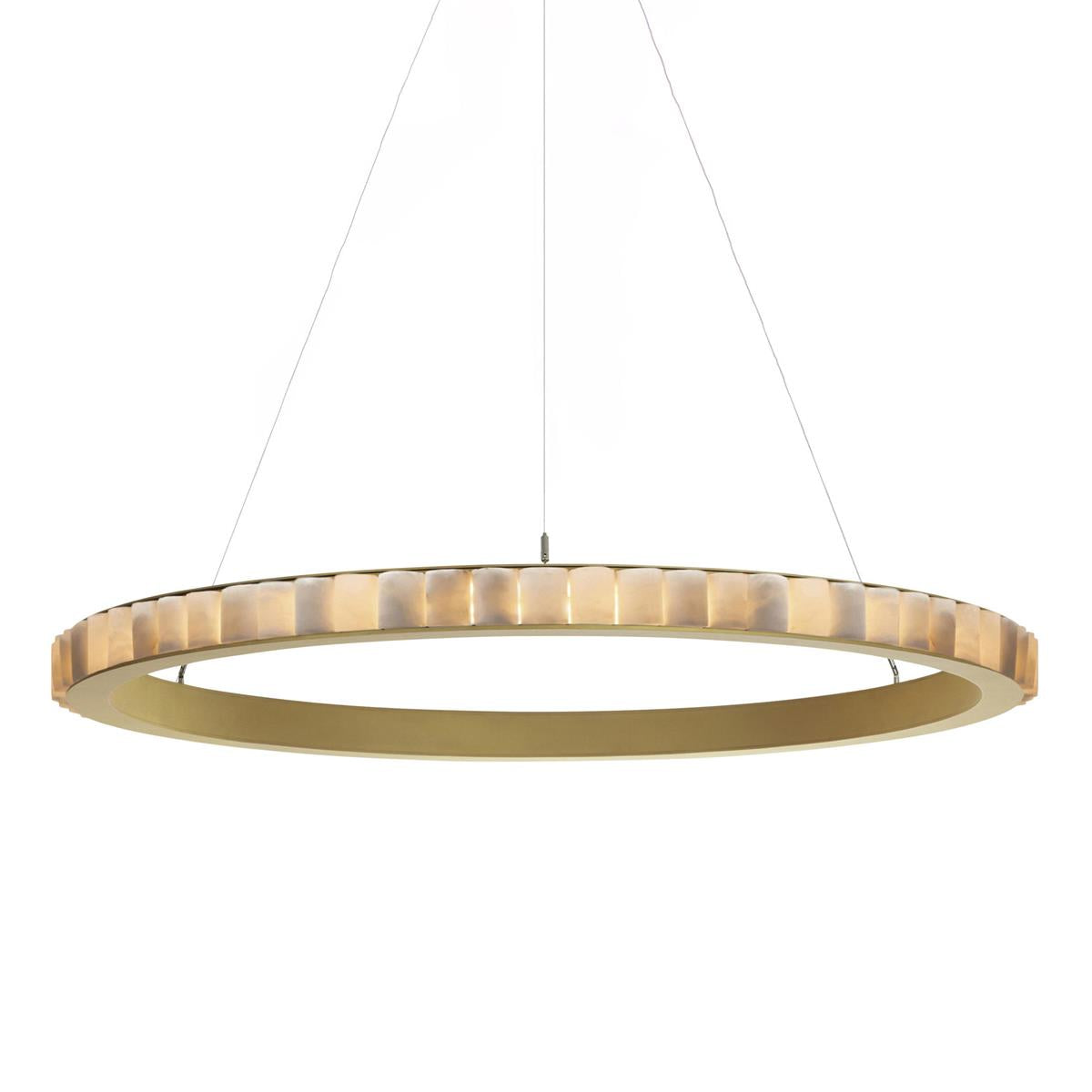 Brass alabaster chandelier lit, warm light washing through alabaster into the brushed gold ring.
