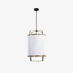 Bamboo and linen pendant light glowing in a warm room
