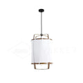 Bamboo pendant light with linen fabric shade glowing warmly