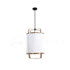 Bamboo pendant light with linen fabric shade glowing warmly