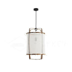 Natural bamboo pendant light casting soft amber light