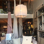 Bamboo pendant light glowing warm in a calm space