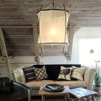 Bamboo pendant light with linen shade in a styled room