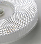 Slim flush mount ceiling light with smooth diffuser surface