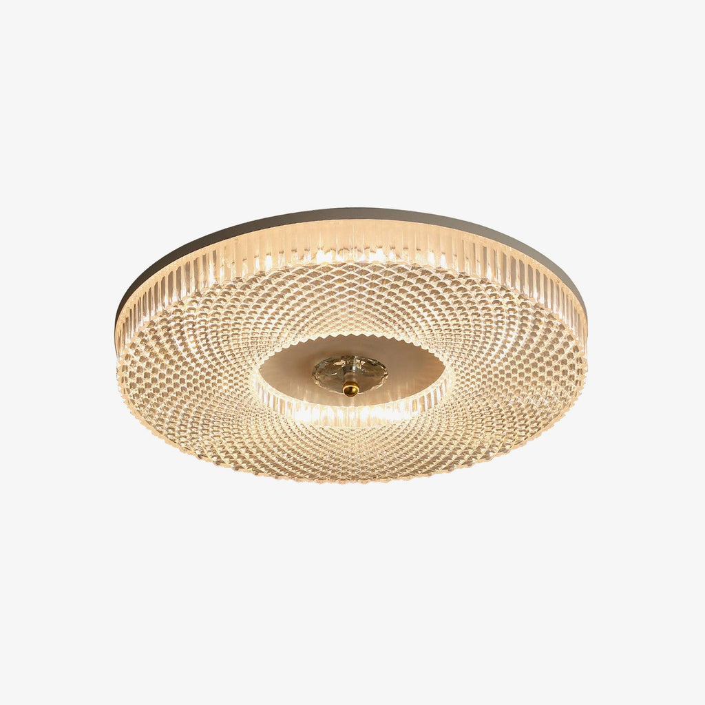 Round flush mount ceiling light glowing in a living space