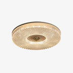 Round flush mount ceiling light glowing in a living space