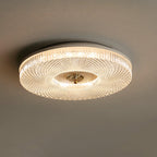 Slim flush mount ceiling light with white acrylic diffuser glowing