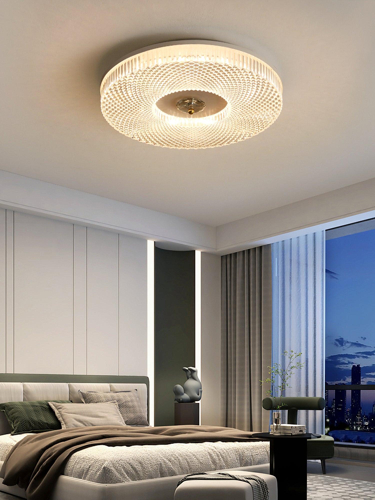 Round flush mount ceiling light with white diffuser lit