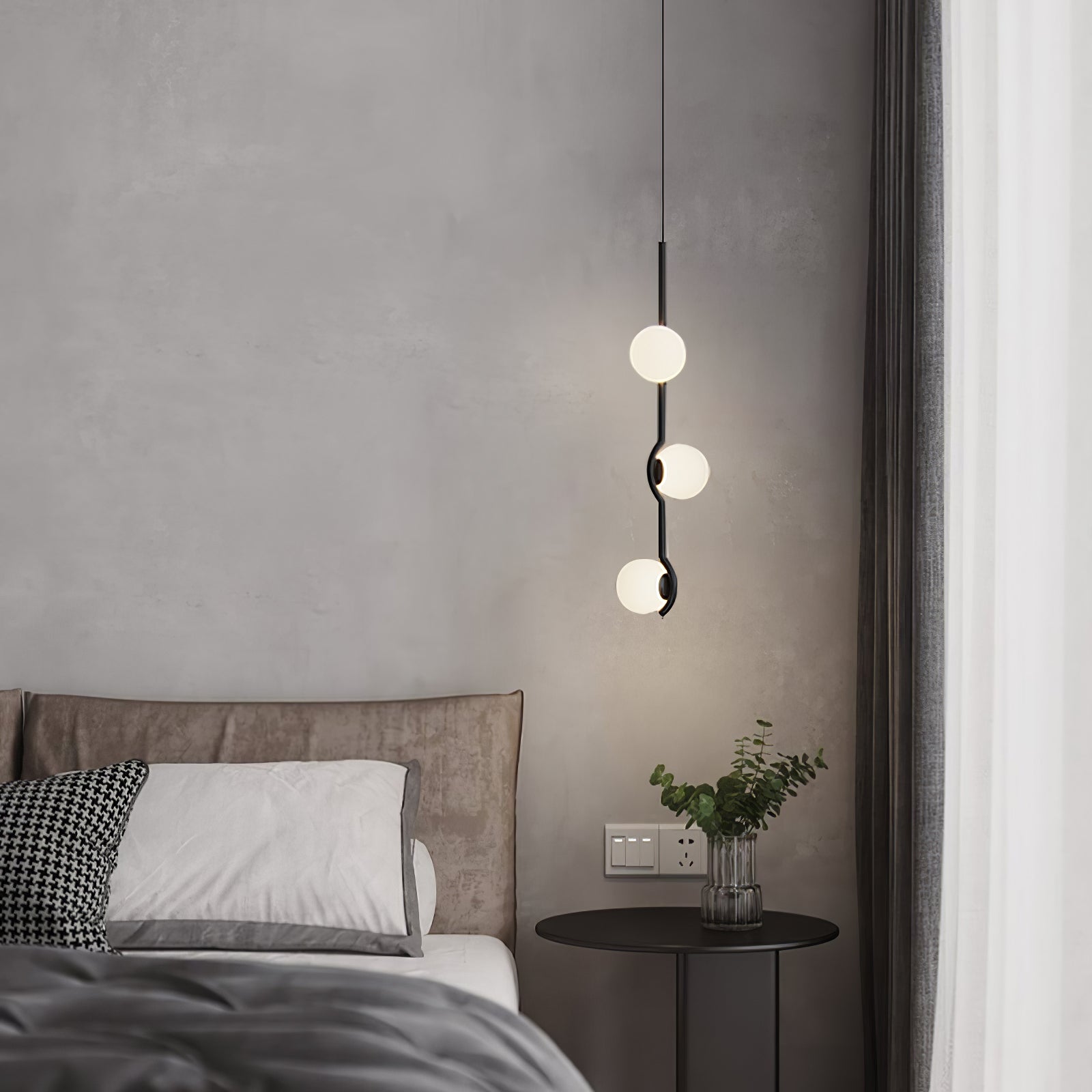 Gold Baer pendant light with warm glowing white globes