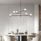 Baer pendant light with white globes above a kitchen island