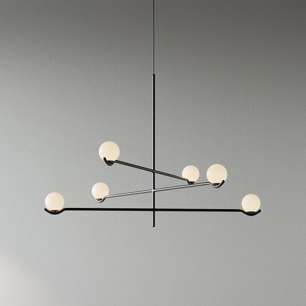 Baer pendant light with white glass globes in a styled room