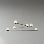 Baer pendant light with white glass globes in a styled room
