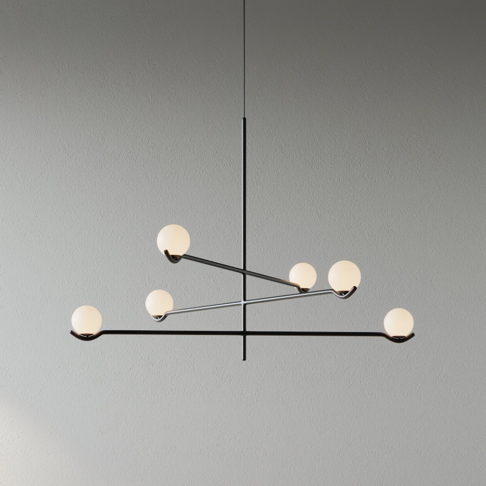 Baer pendant light with white glass globes in a styled room