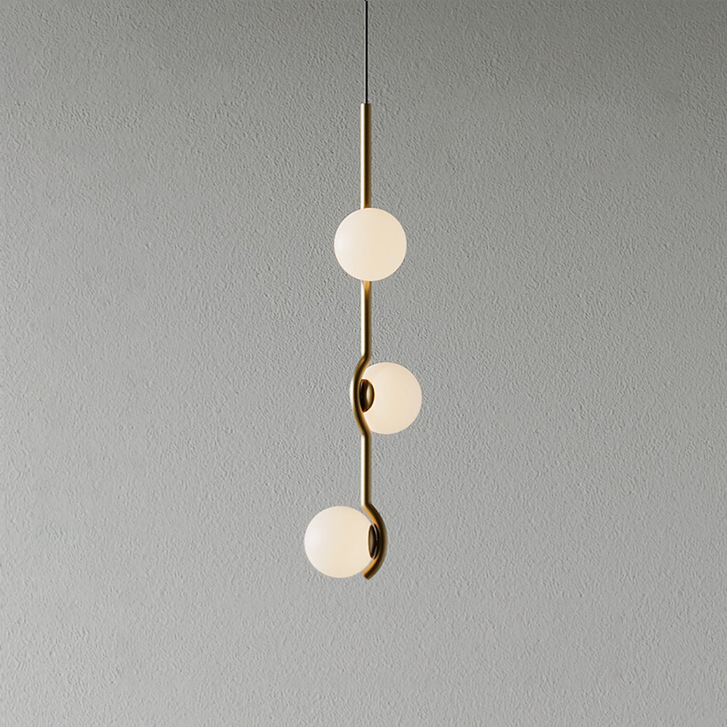White glass Baer pendant cluster glowing softly in a living space