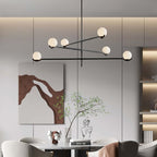 Baer pendant light cluster over a modern dining setting