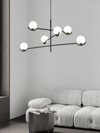 Baer pendant light with white glass shades and gold accents