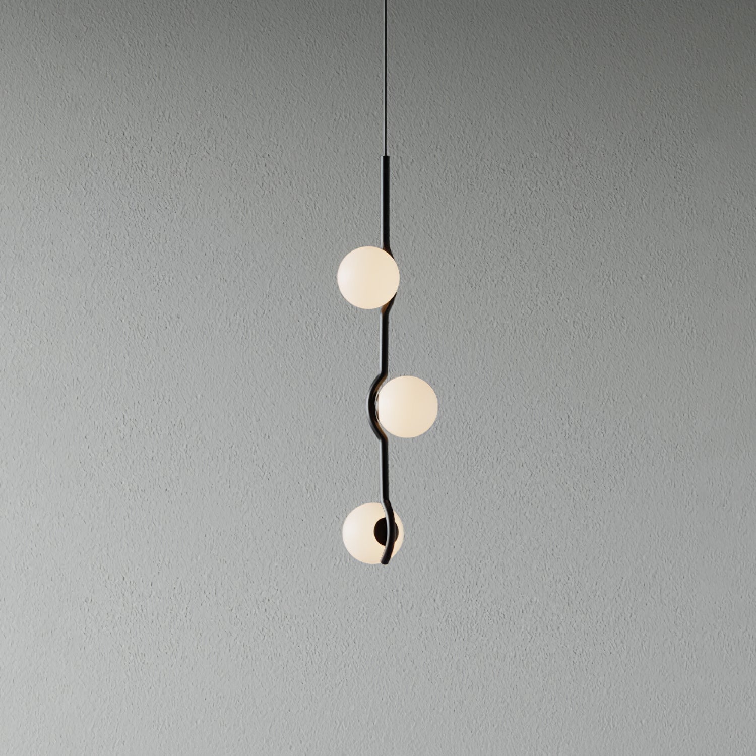 Gold Baer pendant light cluster lit above a table