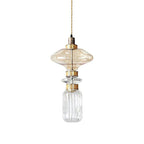Handcrafted glass pendant light casting soft amber light