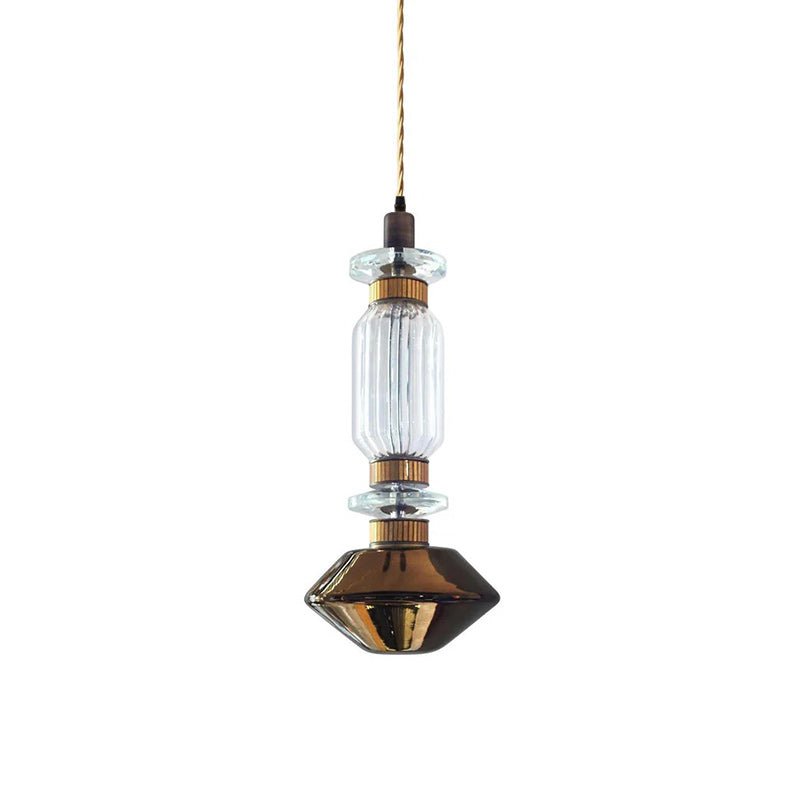Handcrafted glass pendant light with gold body glowing warm
