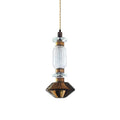 Handcrafted glass pendant light with gold body glowing warm