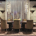 Glass pendant light hanging above a modern dining setting
