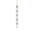 Ballet glass pendant light glowing above a table