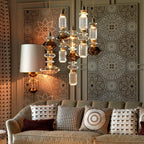 Glass pendant light with gold fitting and warm amber glow