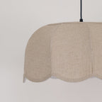 Close view of the scalloped shade exterior on this Clérachic pendant lamp, its petal seams visible.