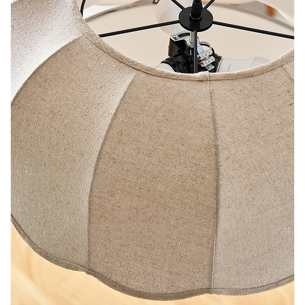 Close view of the fitter and mounting hardware inside the top of this Clérachic pendant lamp's shade.