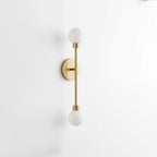 Close view of this Clérachic sconce in brass finish, showing the vertical rod between its two ball shades.