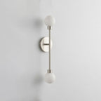 A front view of this Clérachic sconce in satin nickel finish, its two alabaster ball shades on a vertical rod.