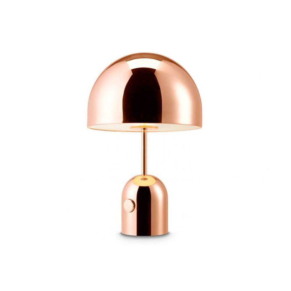 Lit softly, this Clérachic rose gold table lamp stands against a plain white product-shot background.