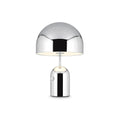 This Clérachic chrome table lamp glows softly against a plain white background in a straightforward product shot.